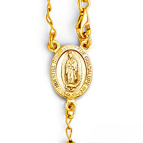 Gold necklace with a pendant on a white background availabe on TX.ORO website.