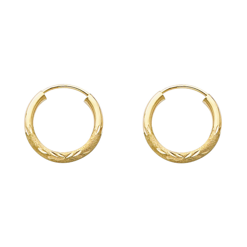 A pair of Gold hoop earrings on a white background available on the TX.ORO website.