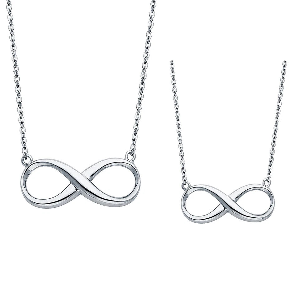 Two silver infinity symbol necklaces on white background available on the TX.ORO website.