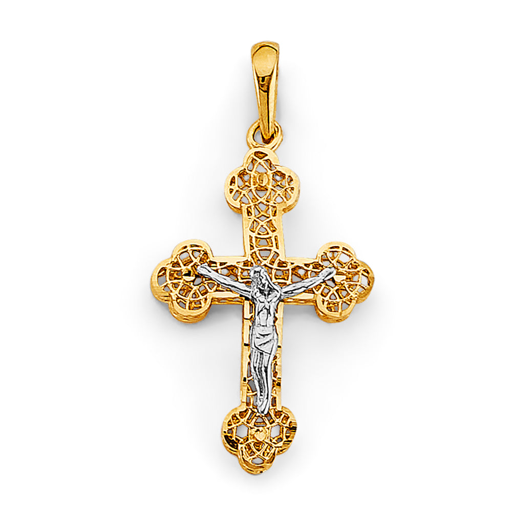Gold and silver crucifix pendant on a white background