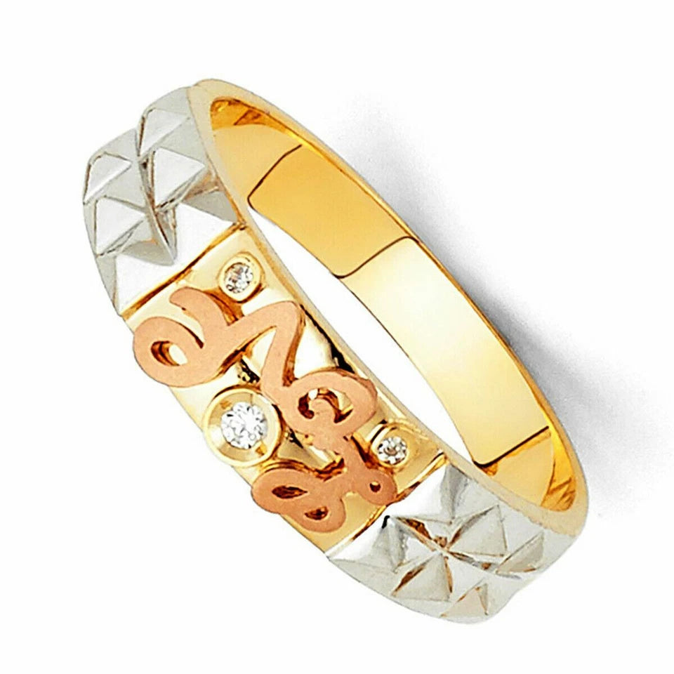 Gold and silver ring with decorative design on a white background availabe on TX.ORO website.