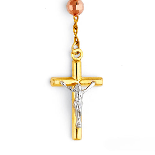 Gold and silver crucifix pendant on a white background availabe on TX.ORO website.