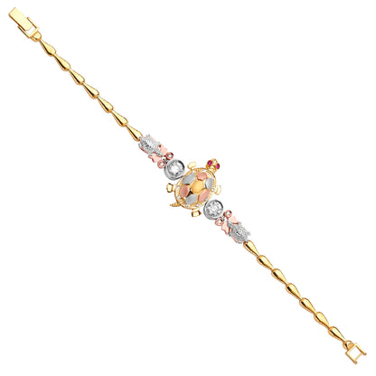 Gold bracelet with a turtle charm on a white background available on the TX.ORO website.