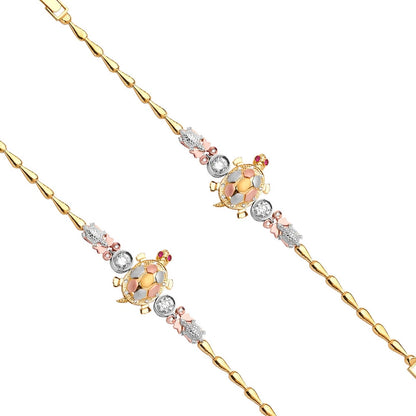 Gold necklace with turtle charms and gemstones on a white background available on the TX.ORO website.