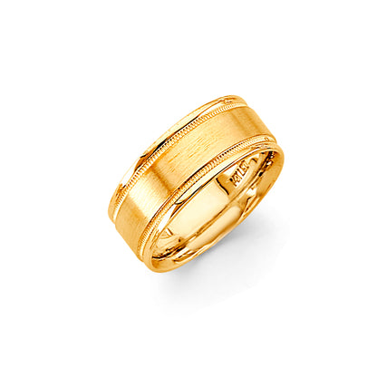 Gold ring with a textured band on a white background