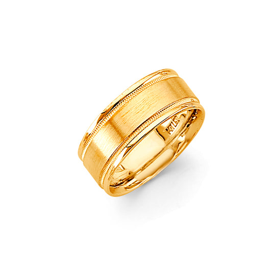 Gold ring with a textured band on a white background