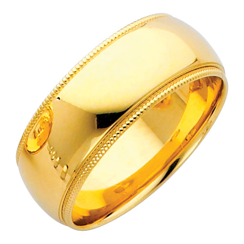 Gold ring with engraved design on a white background