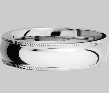 Silver ring with milgrain detailing on a white background