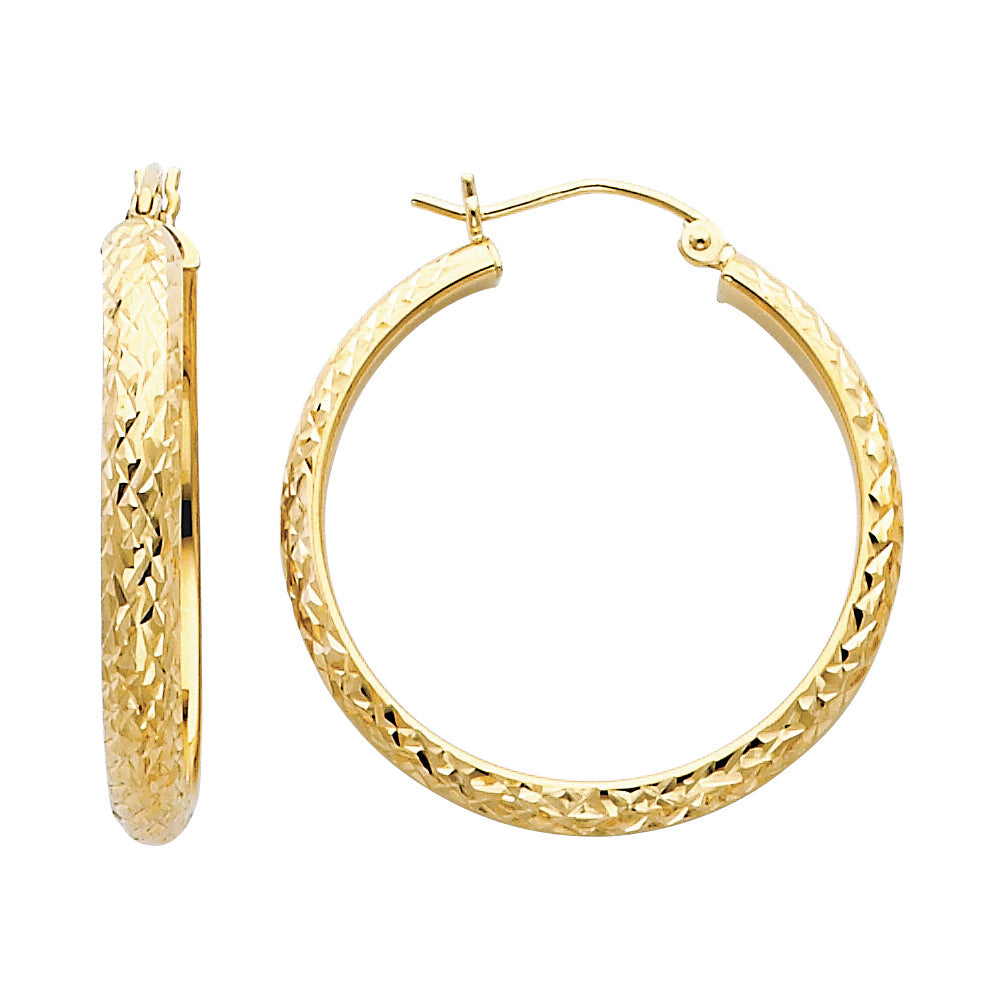 Gold hoop earrings with textured design on a white background