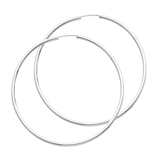 Two silver hoop earrings on a white background available on the TX.ORO website.