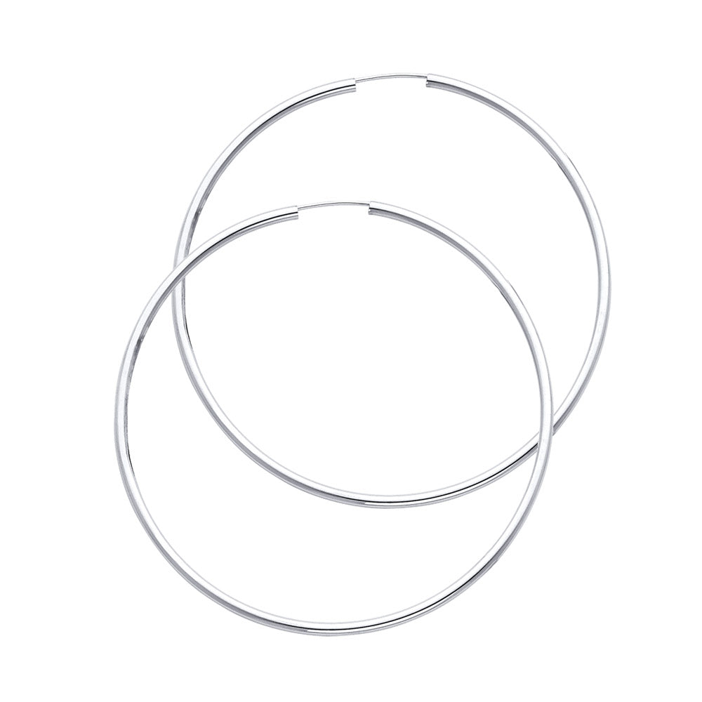 Pair of silver hoop earrings on a white background available on the TX.ORO website.