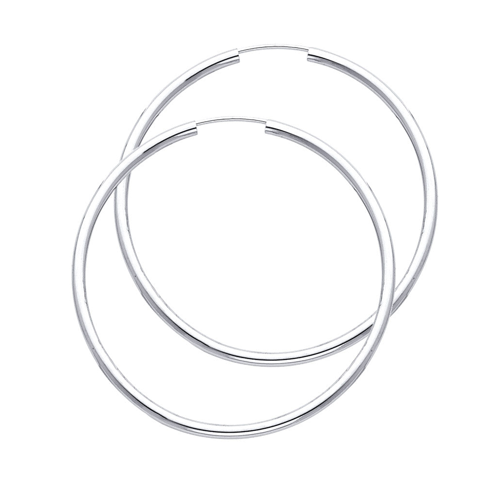 Pair of silver hoop earrings on a white background available on the TX.ORO website.
