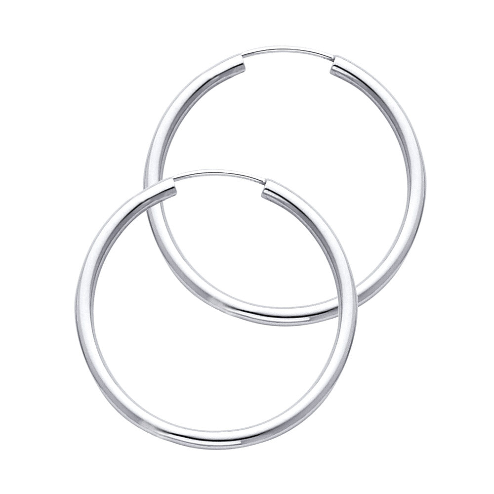 Pair of White Gold hoop earrings on a white background available on the TX.ORO website.