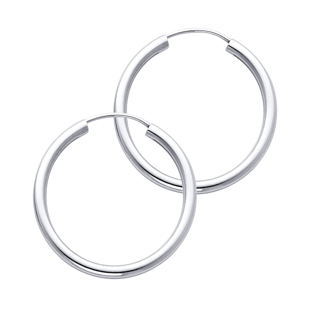 Pair of White Gold hoop earrings on a white background available on the TX.ORO website.