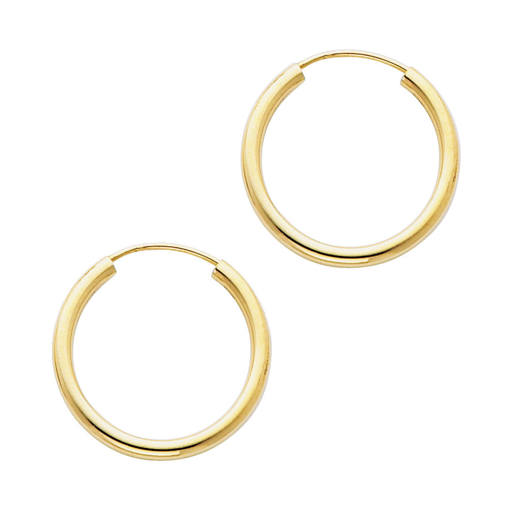 Gold hoop earrings on a white background available on the TX.ORO website.