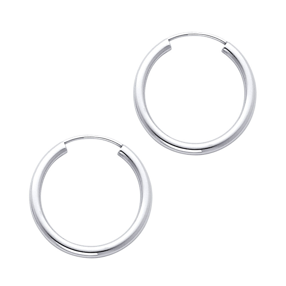 Pair of White Gold hoop earrings on a white background available on the TX.ORO website.