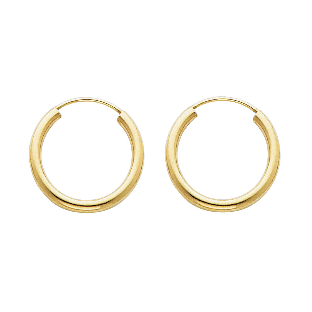 Gold hoop earrings on a white background available on the TX.ORO website.