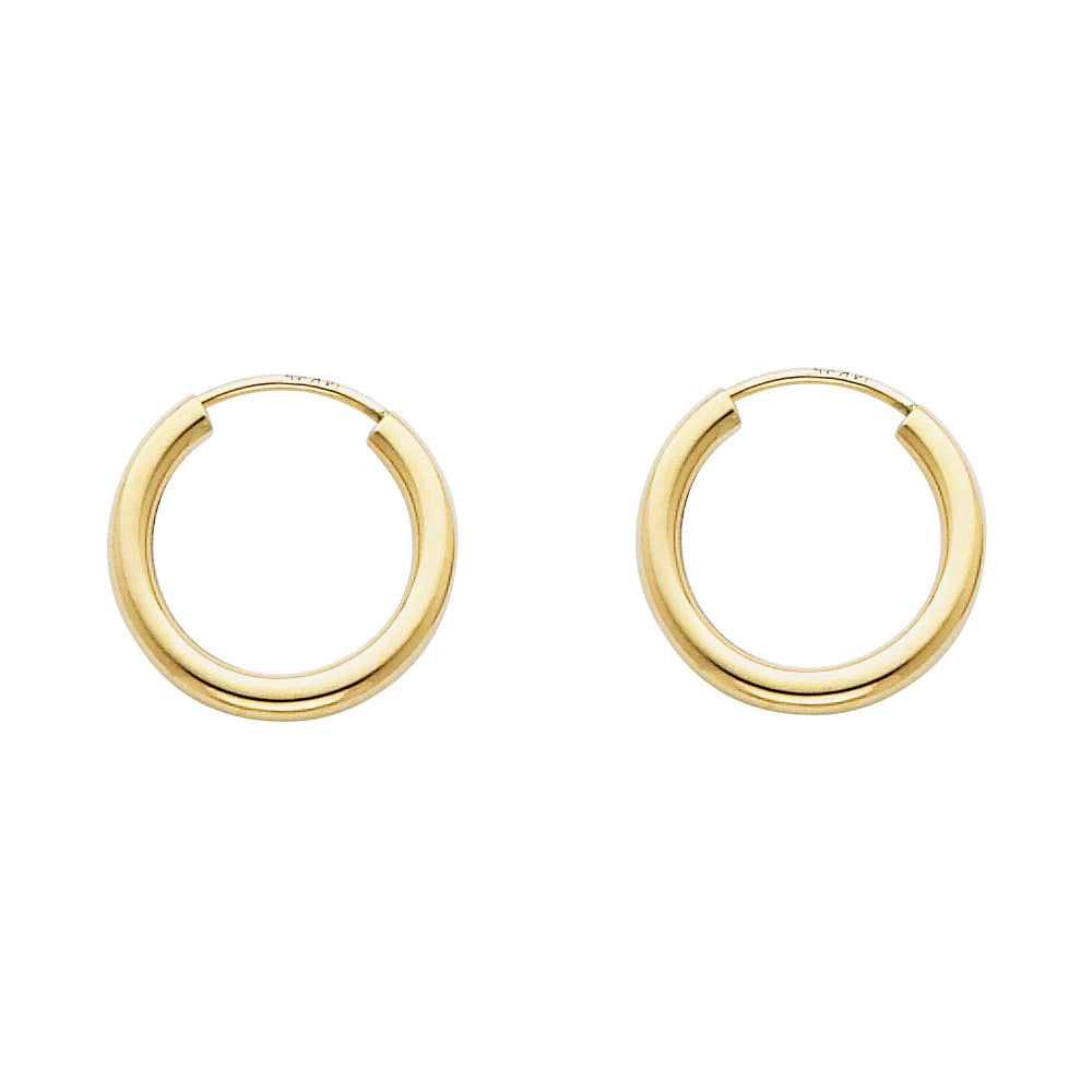 Gold hoop earrings on a white background available on the TX.ORO website.