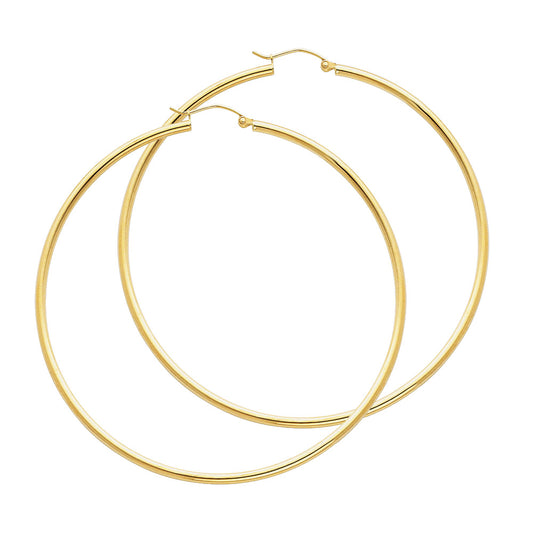 Gold hoop earrings on a white background available on the TX.ORO website.