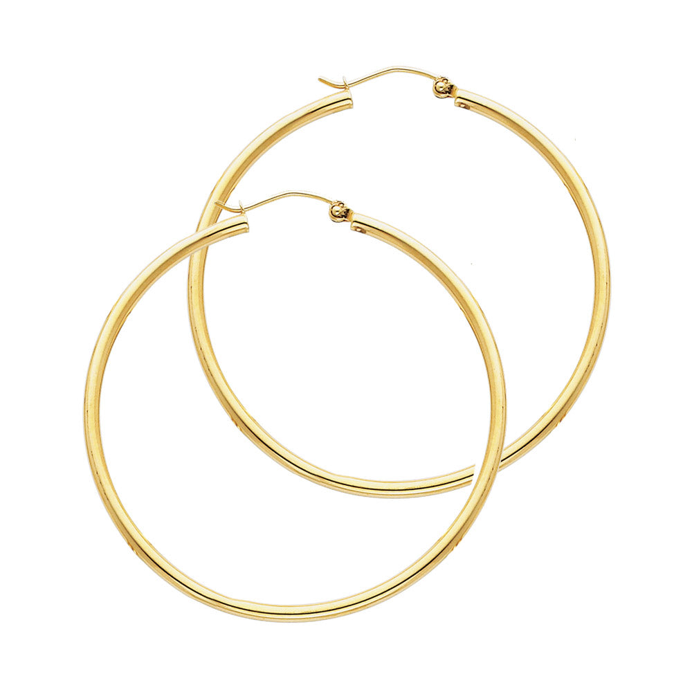 Gold hoop earrings on a white background available on the TX.ORO website.