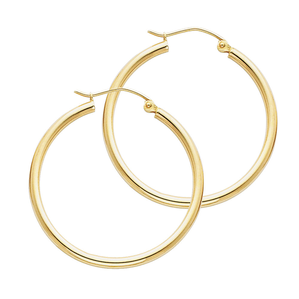 Gold hoop earrings on a white background available on the TX.ORO website.