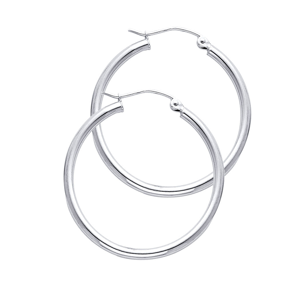 Pair of White Gold hoop earrings on a white background available on the TX.ORO website.