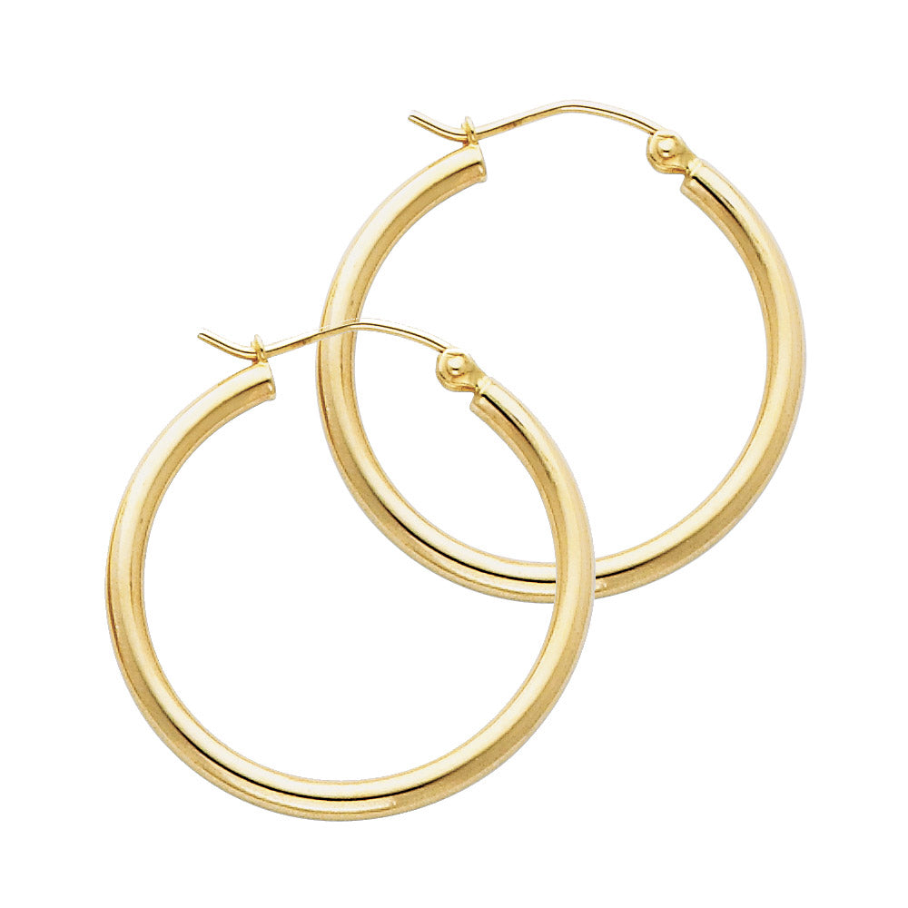 Gold hoop earrings on a white background available on the TX.ORO website.