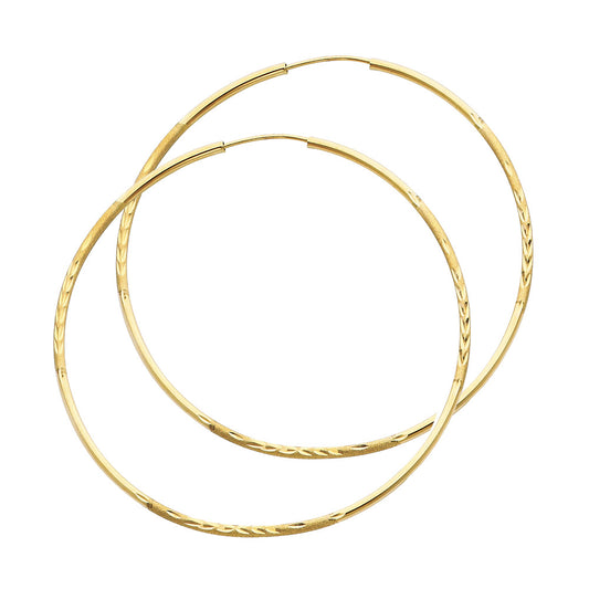 Pair of gold hoop earrings on a white background available on the TX.ORO website.