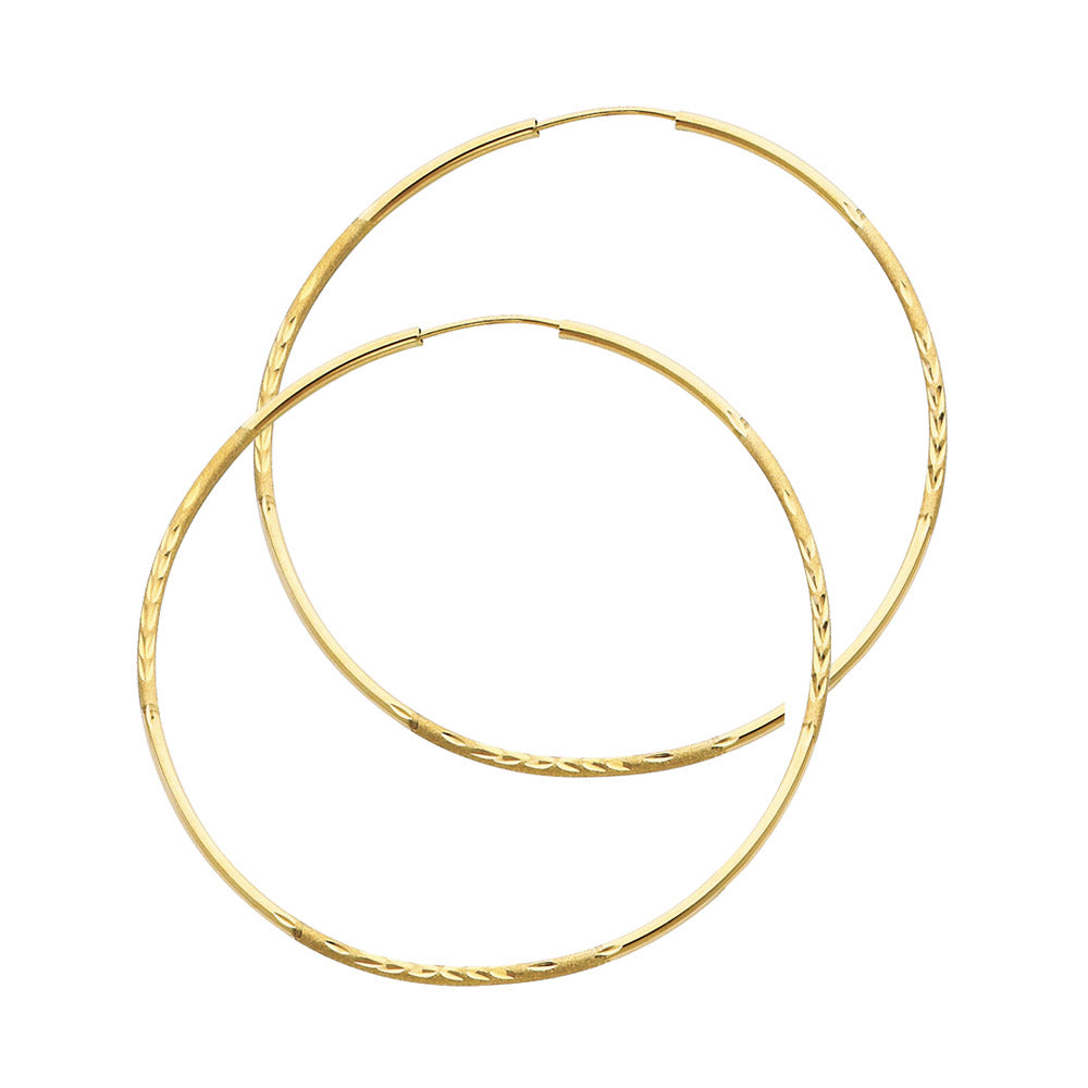 Pair of gold hoop earrings on a white background available on the TX.ORO website.