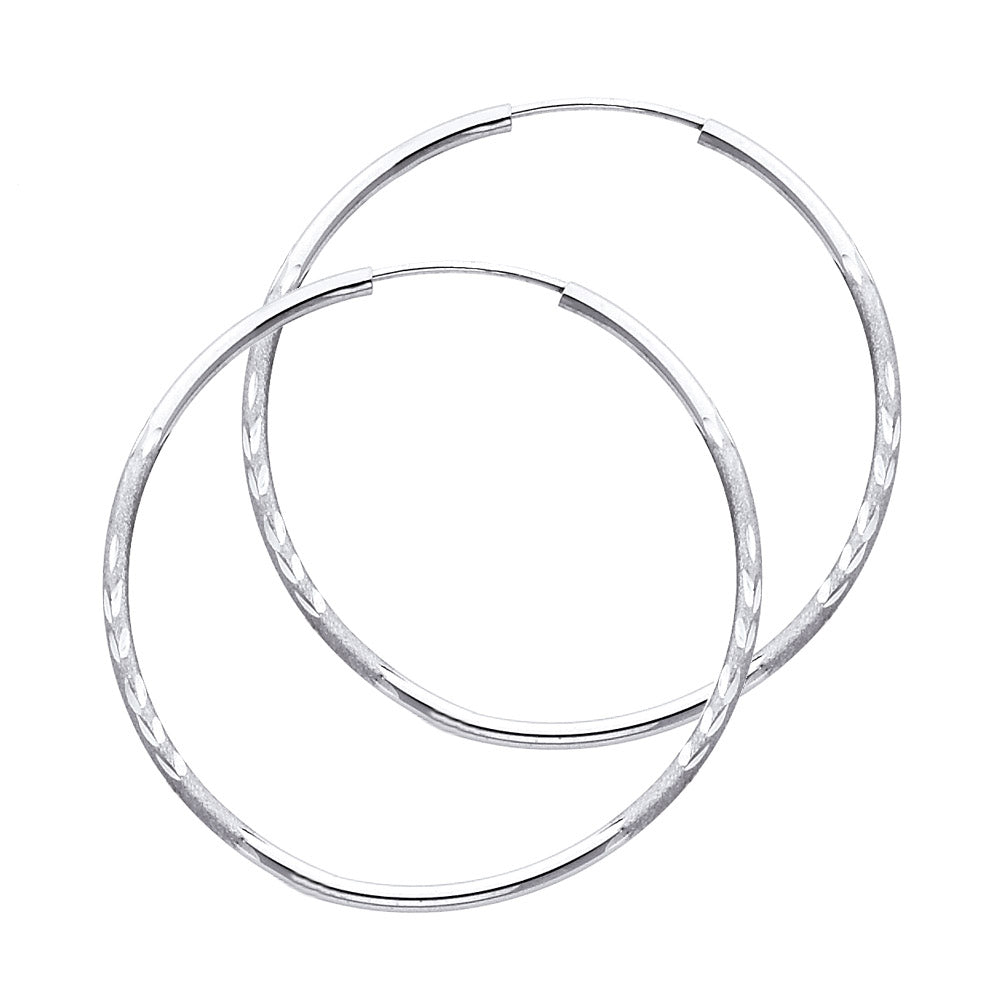 Pair of White Gold hoop earrings on a white background available on the TX.ORO website.