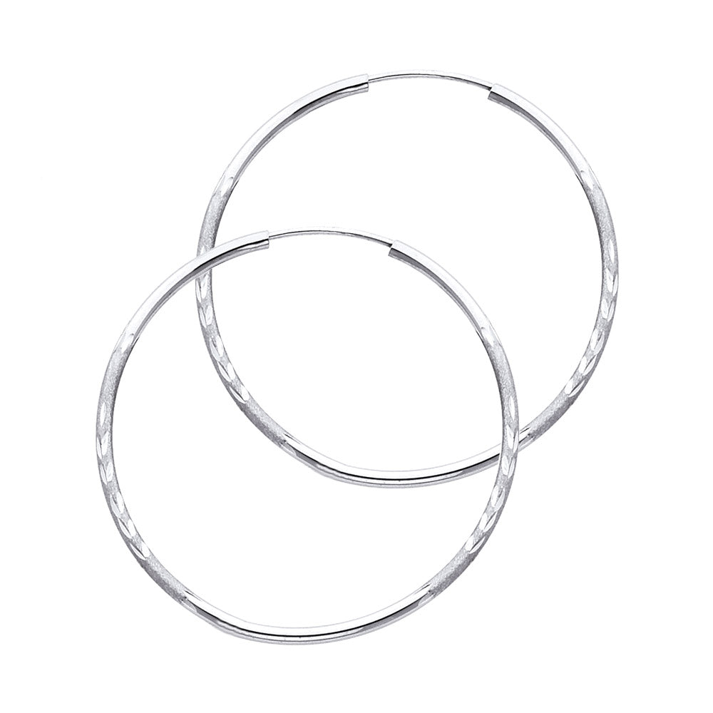 Pair of White Gold hoop earrings on a white background available on the TX.ORO website.