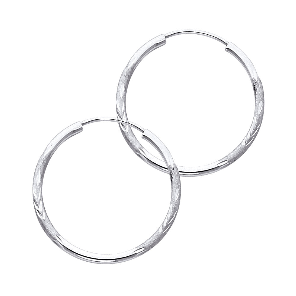 Pair of White Gold hoop earrings on a white background available on the TX.ORO website.
