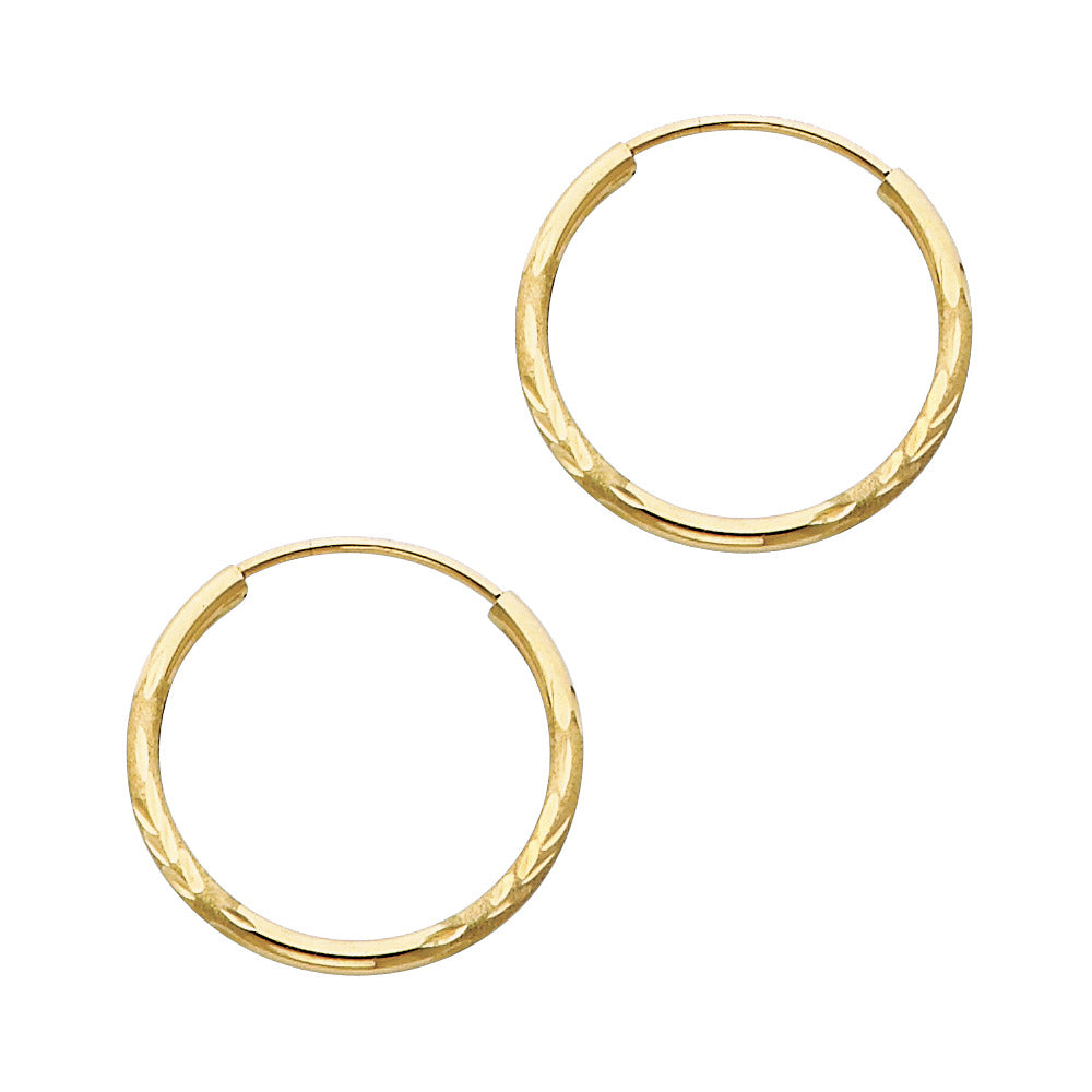 Pair of gold hoop earrings on a white background available on the TX.ORO website.