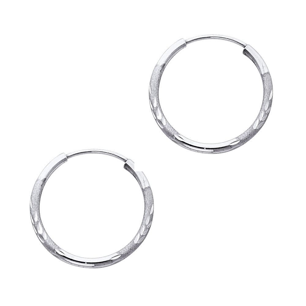 Pair of White Gold hoop earrings on a white background available on the TX.ORO website.