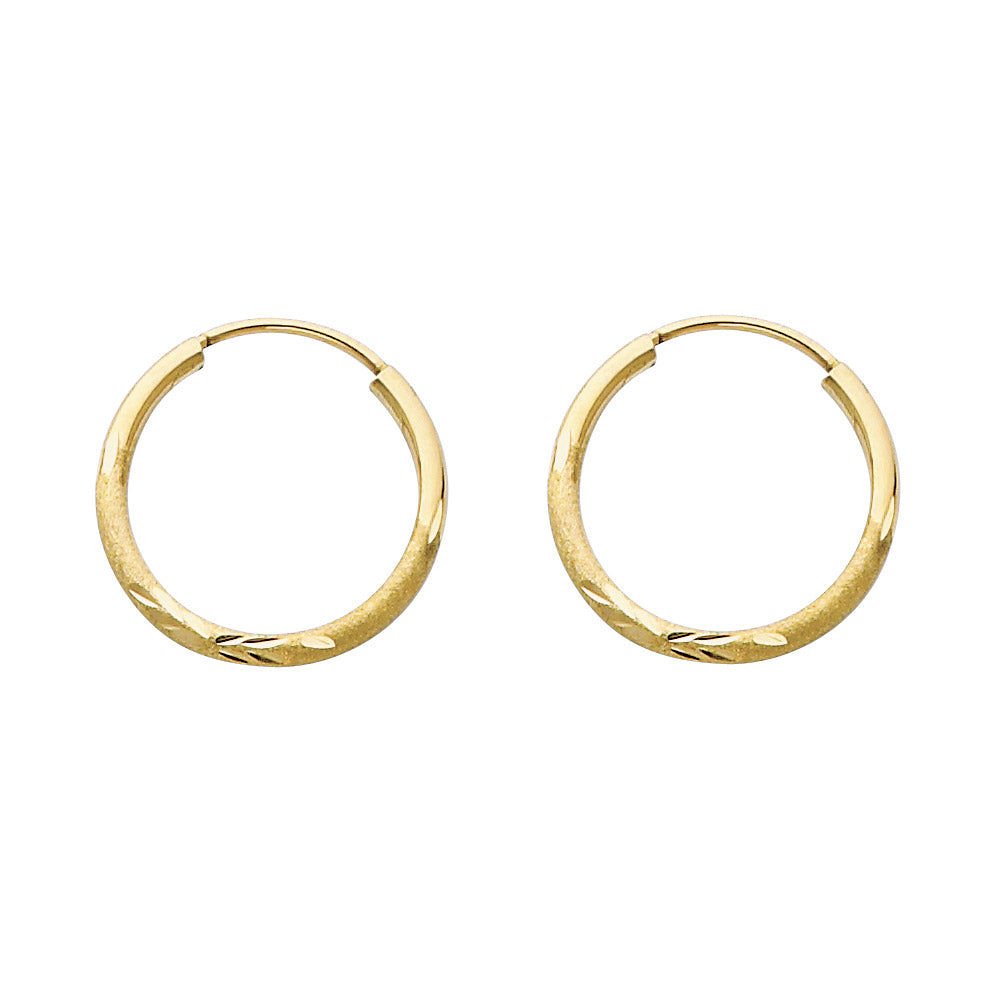 Pair of gold hoop earrings on a white background available on the TX.ORO website.