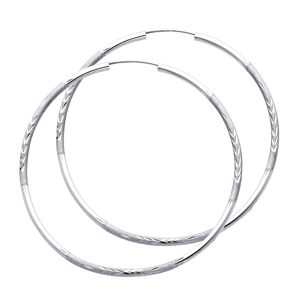 A Pair of White Gold hoop earrings on a white background available on the TX.ORO website.