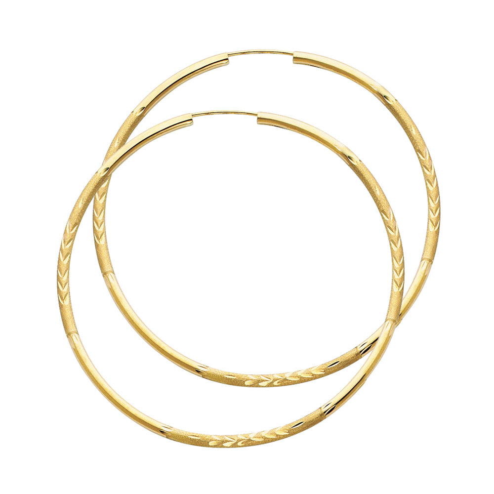 A Pair of Gold hoop earrings on a white background available on the TX.ORO website.