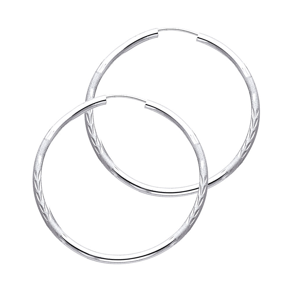 A Pair of White Gold hoop earrings on a white background available on the TX.ORO website.