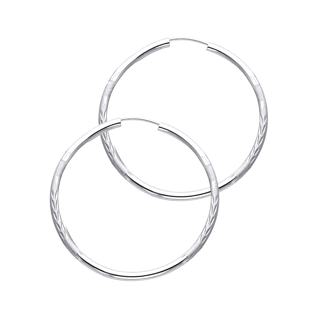 A Pair of White Gold hoop earrings on a white background available on the TX.ORO website.