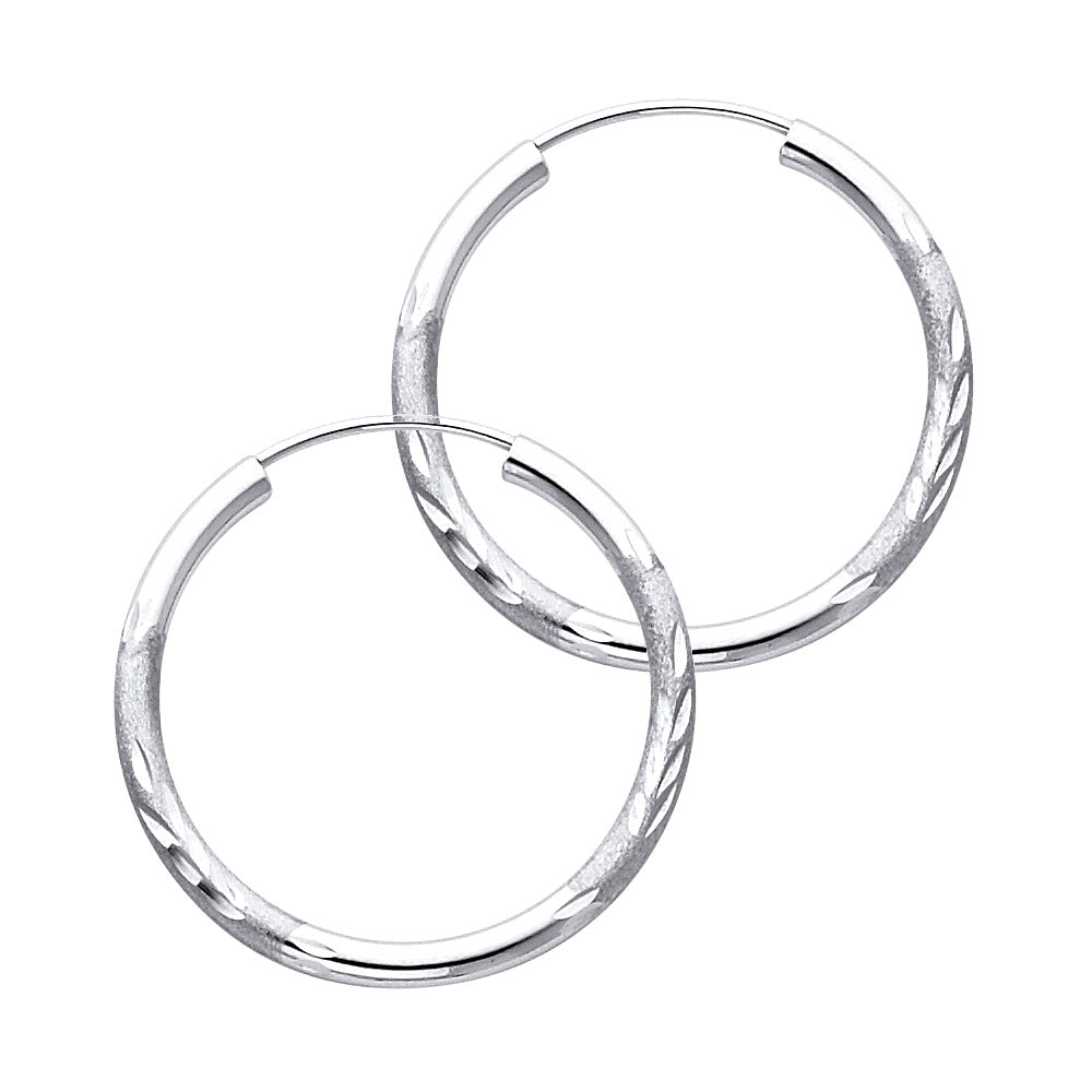 A Pair of White Gold hoop earrings on a white background available on the TX.ORO website.