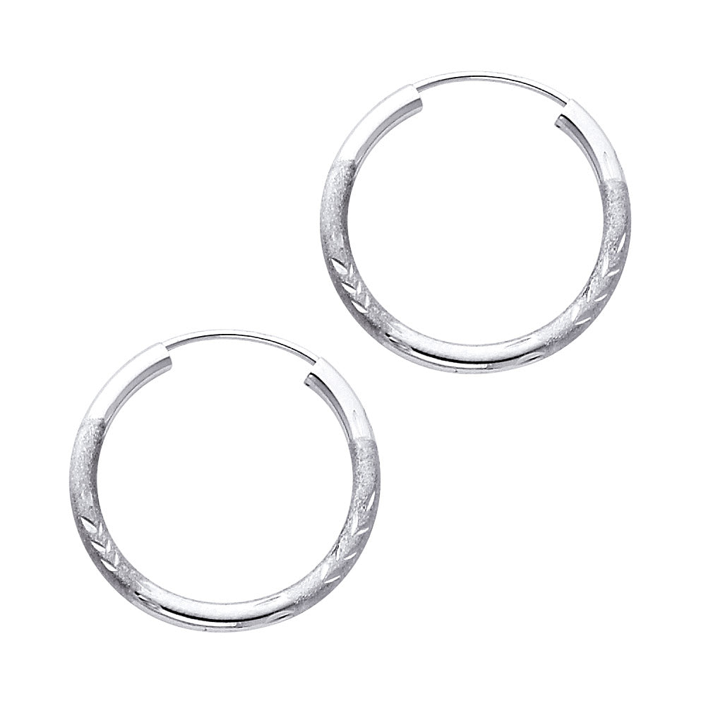 A Pair of White Gold hoop earrings on a white background available on the TX.ORO website.
