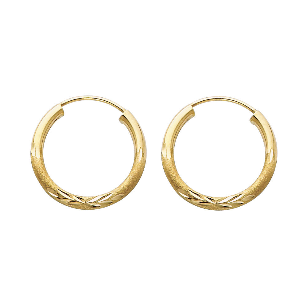 A pair of Gold hoop earrings on a white background available on the TX.ORO website.