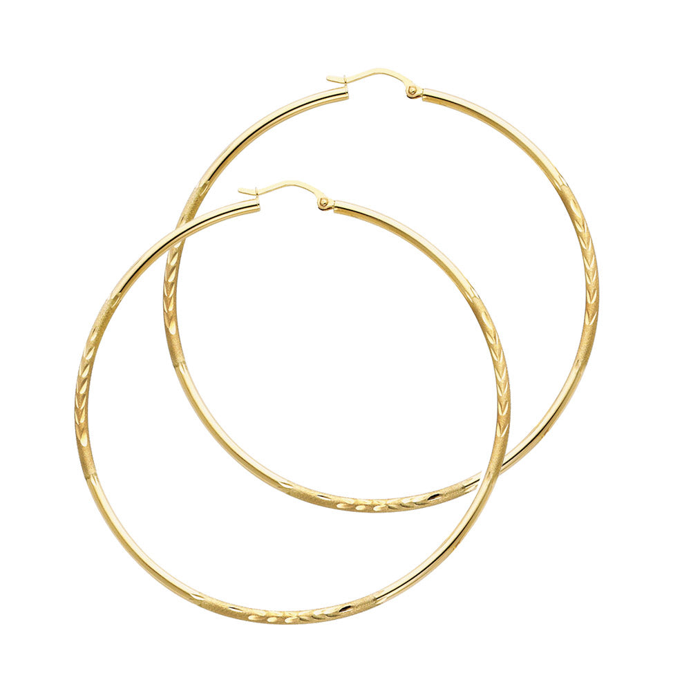 Pair of gold hoop earrings on a white background available on the TX.ORO website.
