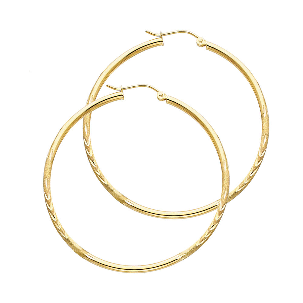 Gold hoop earrings on a white background available on the TX.ORO website.