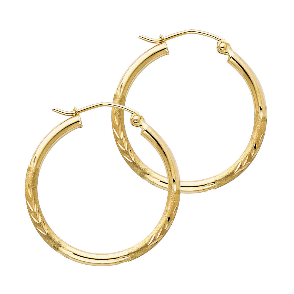 Gold hoop earrings on a white background available on the TX.ORO website.