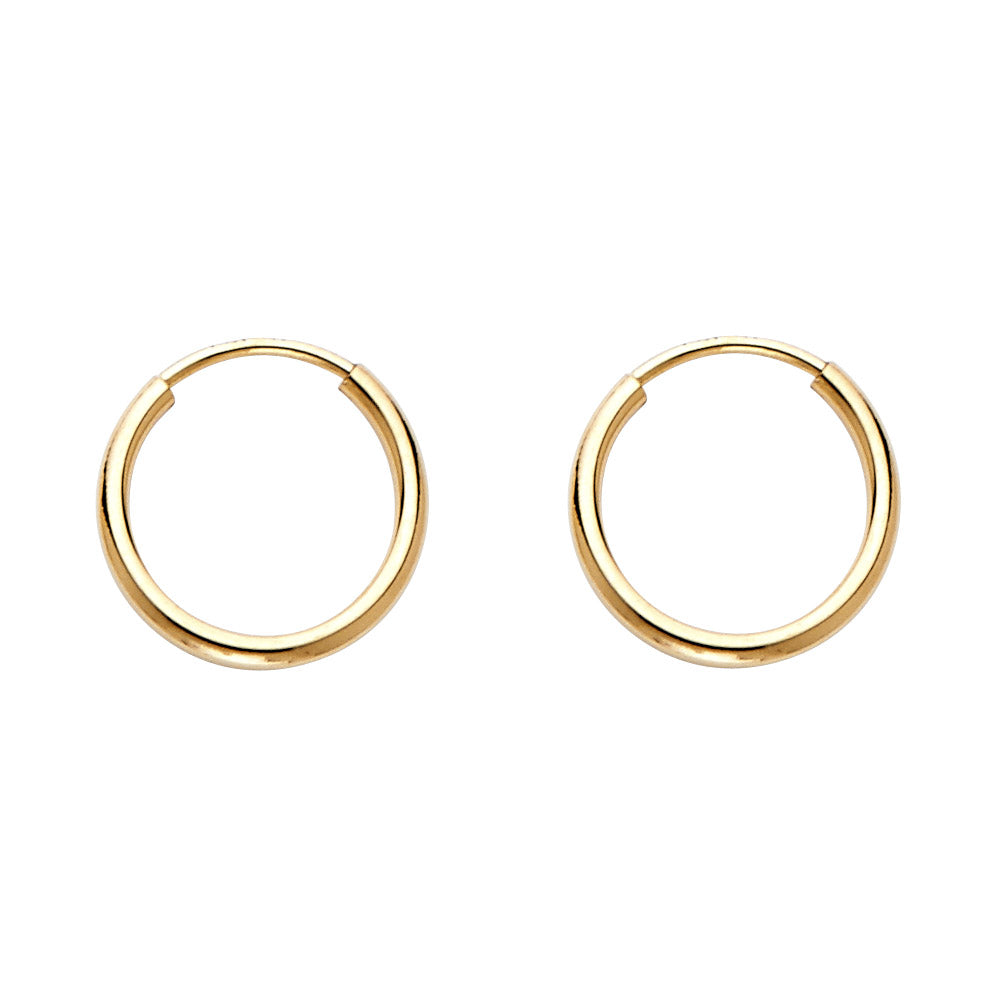 Gold hoop earrings on a white background available on the TX.ORO website.