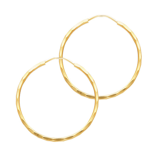 Gold hoop earrings on a white background available on the TX.ORO website.