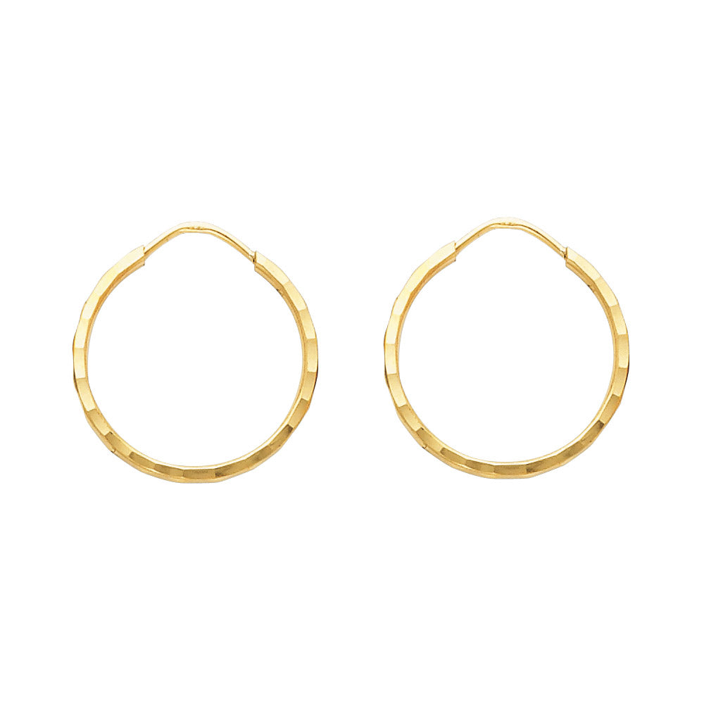 Gold hoop earrings on a white background available on the TX.ORO website.
