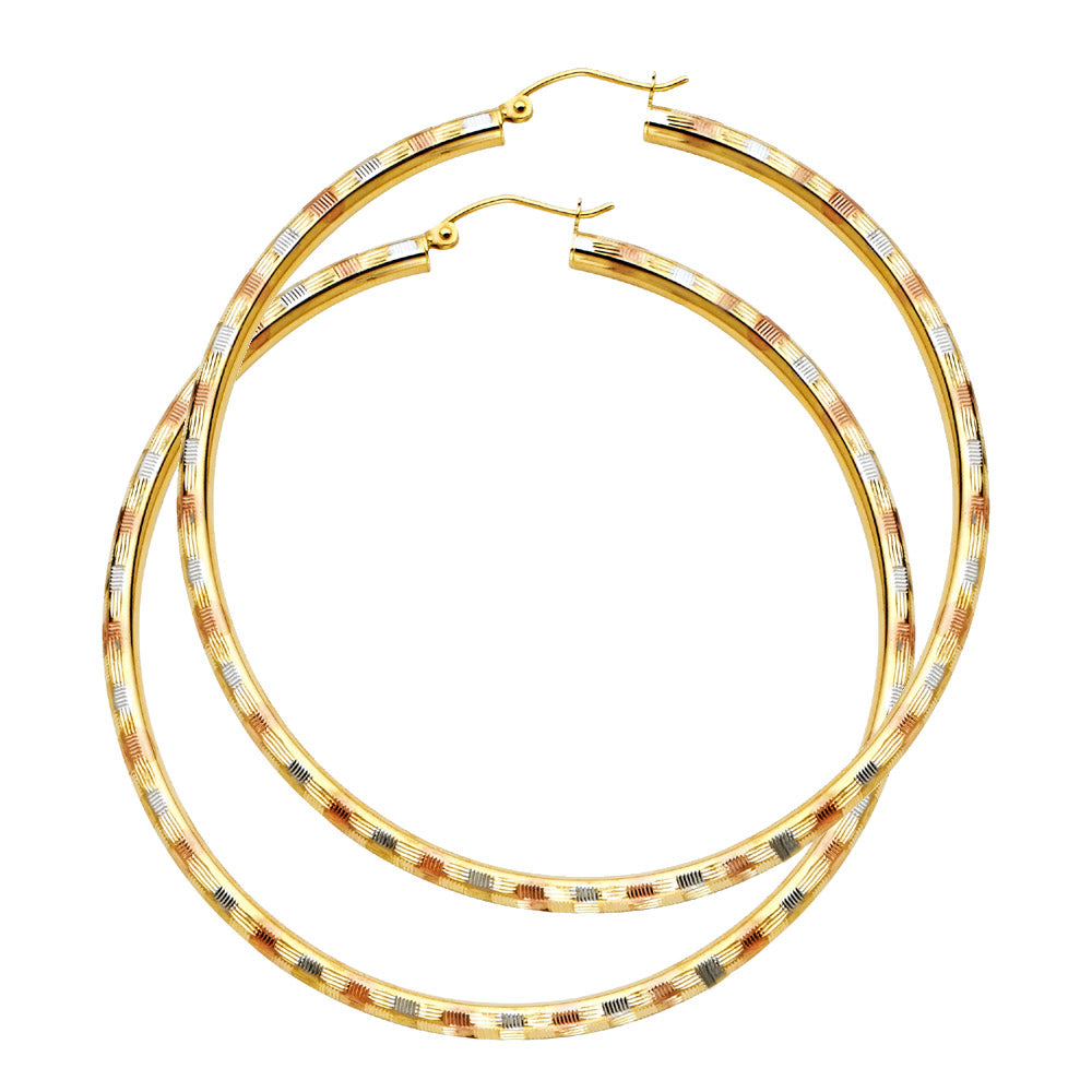Gold hoop earrings on a white background available on the TX.ORO website.