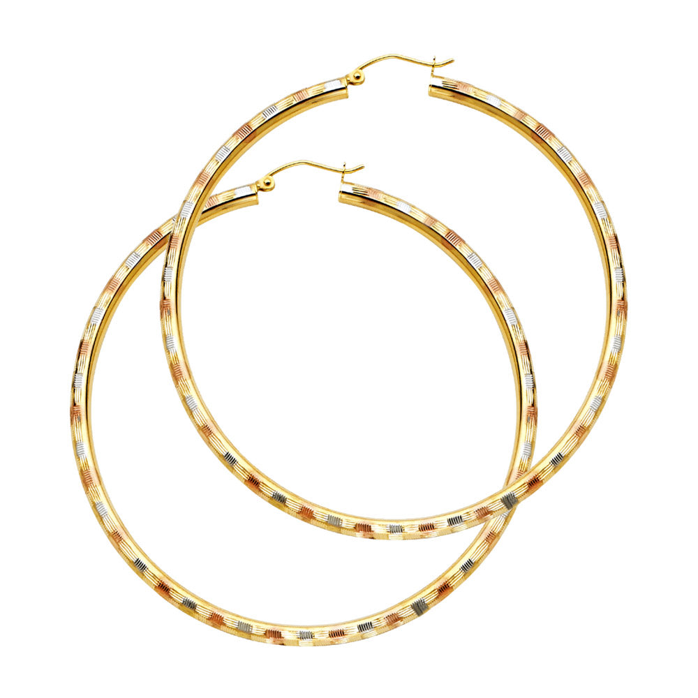 Gold hoop earrings with a textured finish on a white background available on the TX.ORO website.